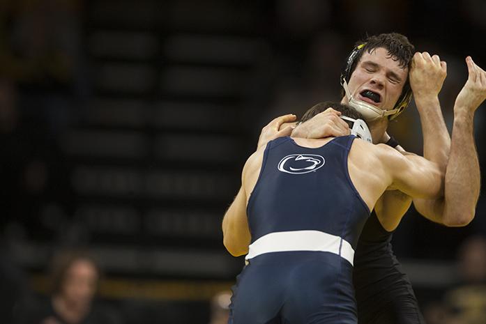Iowas 125-pounder Thomas Gilman reacts while wrestling Penn States Nick Suriano during wrestling meet between Iowa and Penn State in Carver-Hawkeye Arena on Friday, Jan. 20, 2017. The Nittany Lions defeated the Hawkeyes, 26-11. (The Daily Iowan/Joseph Cress)