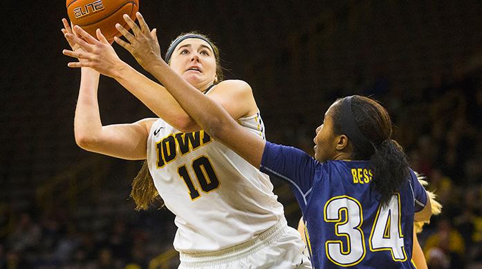 Iowa center Megan Gustafson takes a shot over Kent State forward Zenobia Bess during a womens basketball game in Carver-Hawkeye Arena on Tuesday, Dec. 20, 2016. The Hawkeyes defeated the Golden Flashes, 83-48. (The Daily Iowan/Joseph Cress)