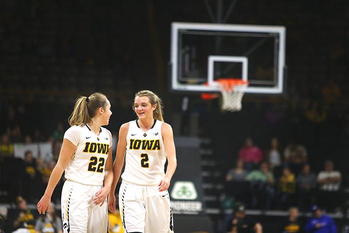 FILE - In this file photo, Iowa guards Kathleen Doyle and Ally Disterhoft talk between quarters during the Iowa-Minnesota game on Saturday, January 21, 2017. Disterhoft received a 4.0 and was named a Big Ten Distinguished Scholar. (The Daily Iowan/Rachael Westergard, file)