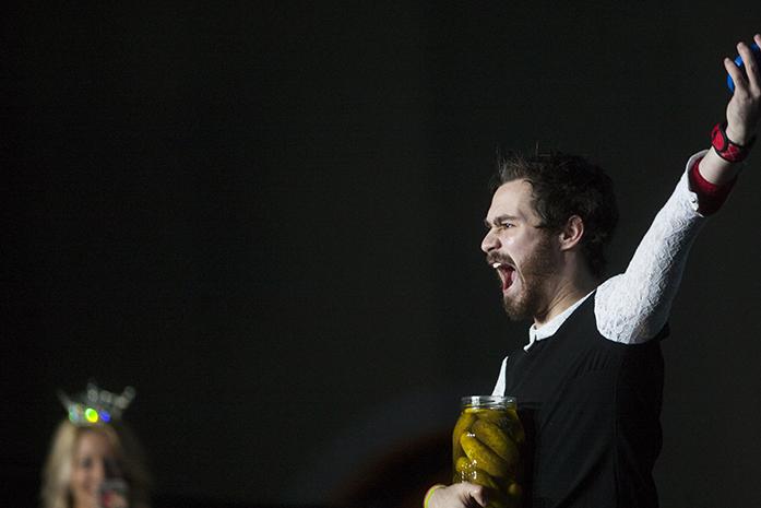 UI junior Greg Frommelt unscrews a pickle jar during the Man Pageant during the ninth hour of the 23rd Dance Marathon at the Iowa Memorial Union on Saturday, Feb. 4, 2017. Frommelt won the pageant competing against five other students. (The Daily Iowan/Joseph Cress)