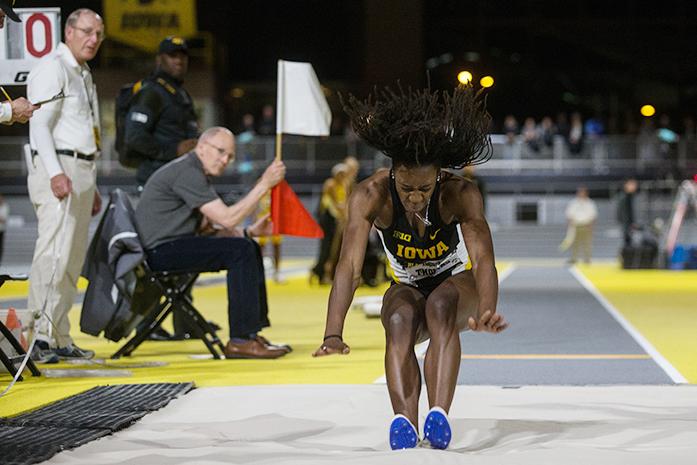 Jahisha Thomas lands in the sand in the long jump during the annual Black and Gold Intrasquad meet at UI Recreation Building, in Iowa City, Iowa  on Friday, Dec. 9, 2016. The track meet was the University of Iowas  christening of its new multi-million-dollar track.(The Daily Iowan/Anthony Vazquez)