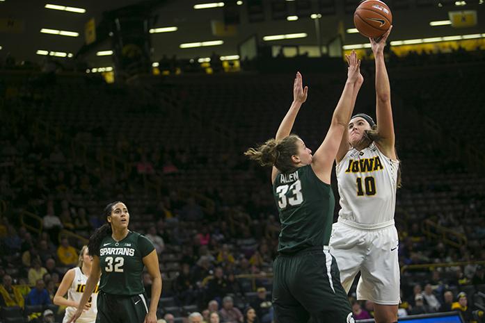 Iowa center Megan Gustafson takes a shot over Michigan State center Jenna Allen during a womens basketball game in Carver-Hawkeye Arena on Thursday, Feb. 9, 2017. The Hawkeyes defeated the Spartans, 87-83 in OT. (The Daily Iowan/Joseph Cress)