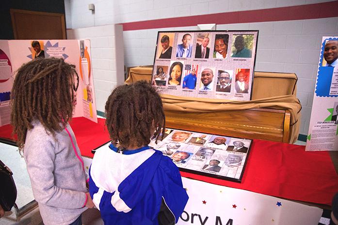 Children walk through a living museum event on Saturday, February 18, 2017, at the Robert E. Lee Community Recreation Center. The event, sponsored by Dream Center, featured local children presenting and personifying and important figures in black history. Black History Month occurs every February. (The Daily Iowan/Olivia Sun)