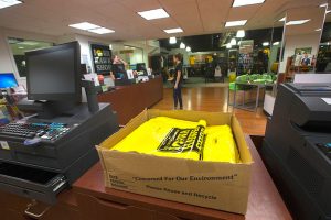 Iowa Hawk Shop bags sit on the counter of the store in the Iowa Memorial Union on Tuesday Feb. 28, 2017. The Hawk Shop wants to reusable bags in the store.