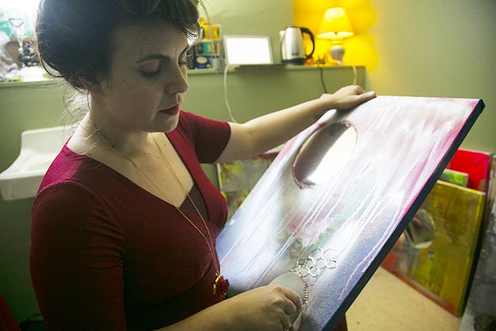 Vero Rose Smith works in her temporary studio space in Public Space One on Wednesday, Feb. 1, 2017. Rose Smith is currently working on a project based on her dreams in conjunction to the progressing phases of the moon. (The Daily Iowan/Joseph Cress)