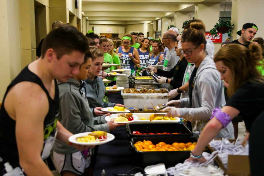 After 13 hours of dancing, participants line up for breakfast in the River Room at the IMU on February 4, 2017. (The Daily Iowan/Osama Khalid)