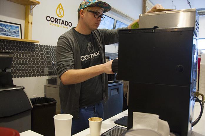 An employee makes tea at Cortado Coffee & Cafe on S. Clinton st. on Thursday, Feb. 23, 2017. Businesses all over Johnson County will be impacted by the change in minimum wage. (The Daily Iowan/Lily Smith)