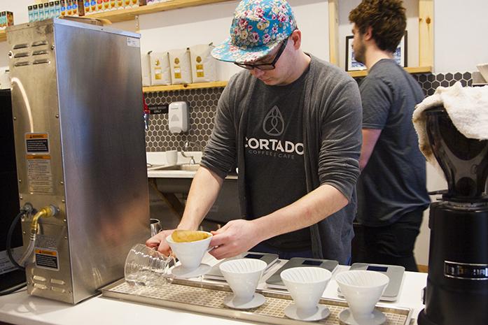 An employee makes tea at Cortado Coffee &amp; Cafe on S. Clinton st. on Thursday, Feb. 23, 2017. Businesses all over Johnson County will be impacted by the change in minimum wage. (The Daily Iowan/Lily Smith)