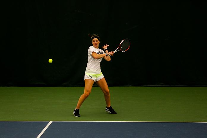 Iowa’s Aimee Tarun returns a shot during her doubles match on January 28, 2017 at the Hawkeye Tennis and Recreation Complex. (The Daily Iowan/Osama Khalid)
