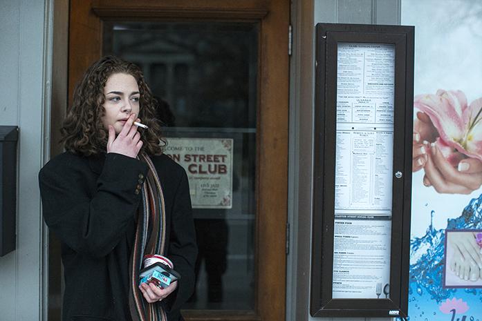 Bailey O’Brien smokes a cigarette outside of Clinton Street Social Club on Sunday, Jan. 22, 2017 in Iowa City, IA. O’Brien has been an employee with the Social Club for over a year, and enjoys the job as she gets to meets interesting people from around Iowa City. (The Daily Iowan/Joshua Housing)
