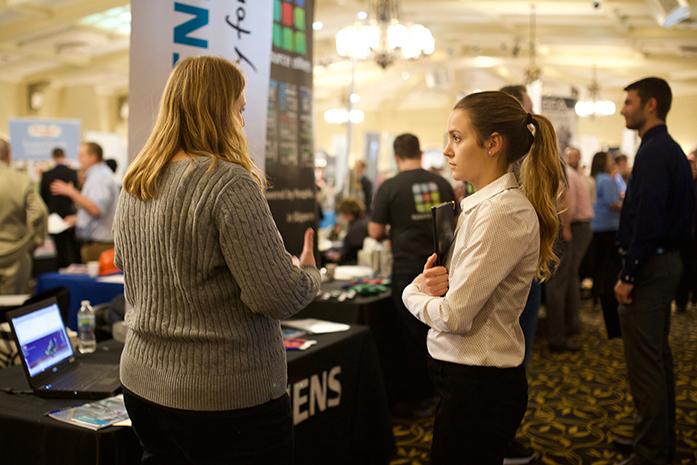 Students at the Engineering Career Fair at the IMU on Tuesday, Feb. 14. The UI has an average of 25% female students enrolled in engineering, compared to the national average of 20%. Women are shown to be less likely than men to pursue STEM degrees, and black and Hispanic students are less likely than white students. (The Daily Iowan/Olivia Sun)