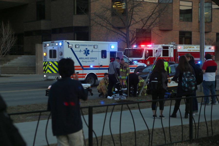 Emergency crews respond to an incident on Madison Street by Gibson Square park on Tuesday, Feb. 14, 2017. This story is developing. (The Daily Iowan/Joseph Cress) 