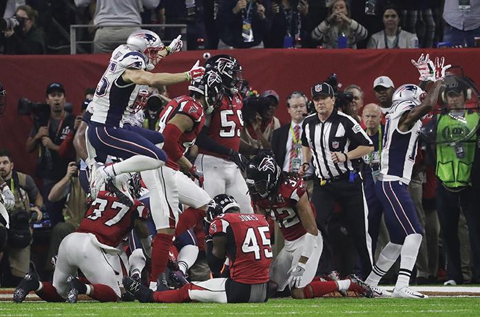 The New England Patriots celebrate after their overtime win in the NFL Super Bowl 51 football game against the Atlanta Falcons Sunday, Feb. 5, 2017, in Houston. (AP Photo/Chuck Burton)