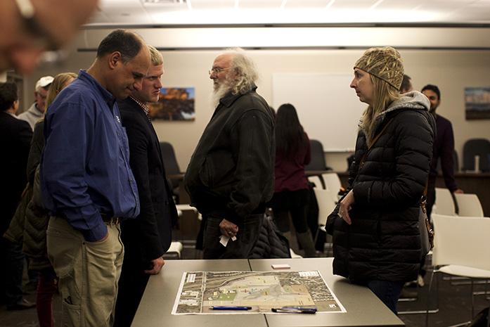 Residents examine a map during the Johnson County Poor Farm Master Plan on Wednesday, Mar. 1, 2017, in the Johnson County Health and Human Services building. In 1855, the Poor Farm Area was used as an asylum. (The Daily Iowan/Kenny Sim)