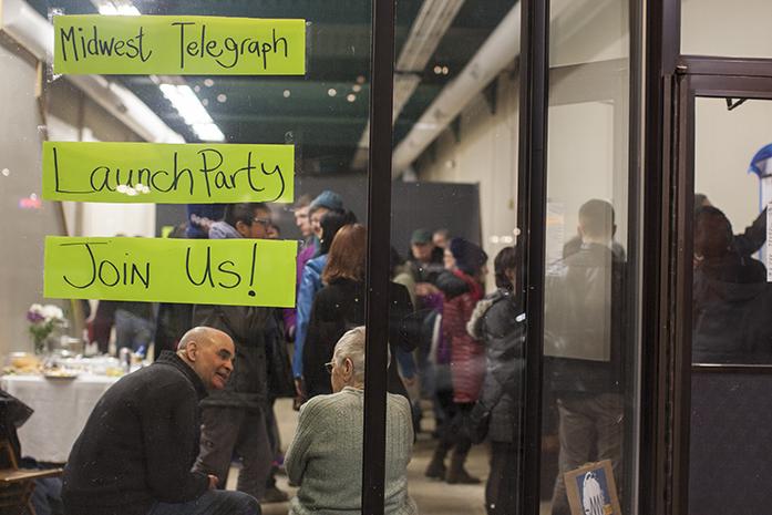 Community members gather during a launch party for the Midwest Telegraph in the former location of The Den in downtown Iowa City on Friday, Mar. 3, 2017. The Midwest Telegraph is a website for organizing social movements. (The Daily Iowan/Joseph Cress)