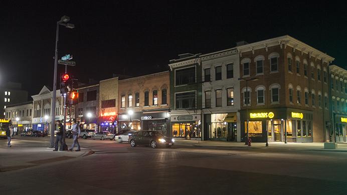 Cars drive down Clinton Street on Tuesday, March 7, 2017. This week, the Iowa City Downtown District is looking for a Nighttime Mayor to link together local businesses, city departments, and the University.