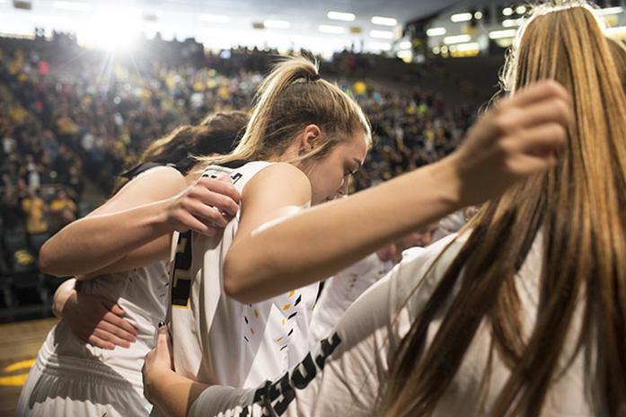 Iowa guard Ally Disterhoft huddles with teammates before a second round Women's National Invitation Tournament against South Dakota in Carver-Hawkeye Arena on Saturday, March 18, 2017. The Hawkeyes defeated the Coyotes, 78-73. (The Daily Iowan/Joseph Cress)