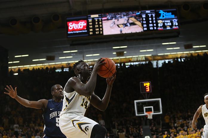 Iowa guard Peter Jok goes up for a layup during the Iowa-Penn Stae game in Carver-Hawkeye Arena on Sunday, March 5, 2017. The Hawkeyes defeated the Nittany Lions, 90-79. (The Daily Iowan/Margaret Kispert)