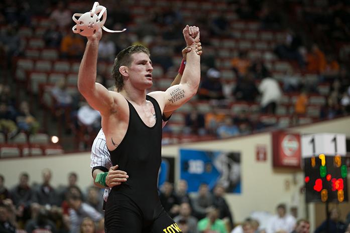 Iowa’s Sam Brooks has his hand raised as the victor during the Big Ten Wrestling Championships in the Simon Skjodt Assembly Hall in Bloomington, Indiana on Sunday, March 5, 2017. Sam Brooks successfully defended his title of the Big Ten Champion with a victory. Ohio State was named the Big Ten Champion at the end of the two day event.(The Daily Iowan/Anthony Vazquez)