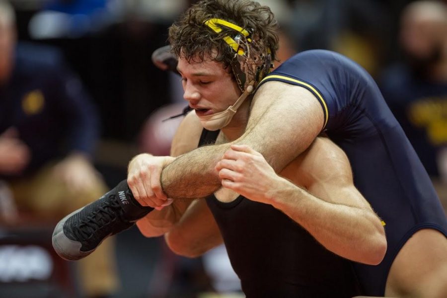 Thomas Gilman works on Michigan wrestler Conor Youtsey in the semifinal match of the Big Ten Championships in Bloomington, Indiana March 4, 2017. (Anthony Vazquez/ The Daily Iowan)