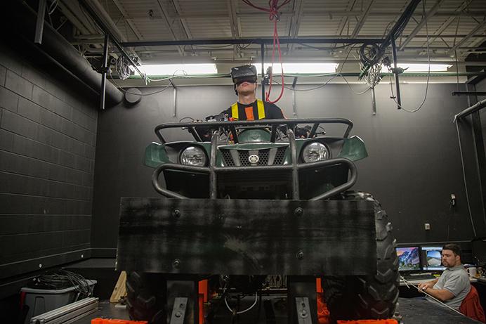 University of Iowa Student Kyle Losik test drives the ATV Simulator at the Center of Computer-Aided Design on Wednesday, June 22, 2016. The new ATV simulator will allow researchers to run tests simulating a variety of scenarios in a controlled environment. (The Daily Iowan/Anthony Vazquez)