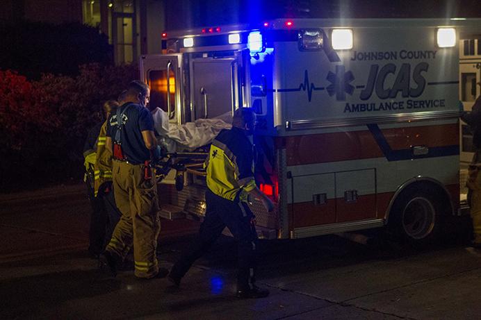 Ambulance takes away a intoxicated drinker at east Washington St. on Friday, Oct. 9, 2015. Downtown district was packed with people celebrating homecoming. (The Daily Iowan/Peter Kim)