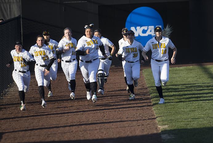 Iowa players warmup during a softball game against Valparaiso at Bob Pearl Field in Iowa City on Friday, March 17, 2017. The Hawkeyes defeated the Crusaders, 3-0. (The Daily Iowan/Joseph Cress)