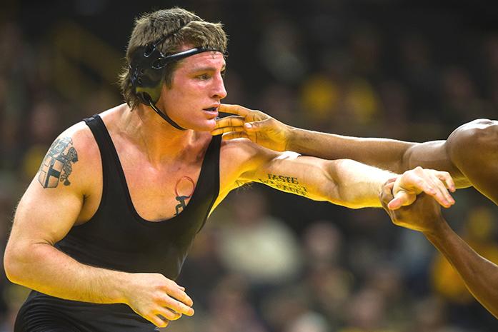 Iowas+Sammy+Brooks+fends+off+Ohio+States+Myles+Martin+during+the+Iowa+v.+Ohio+State+Wrestling+match%2C+in+Carver-Hawkeye+Arena+in+Iowa+City%2C+Iowa++on+Friday%2C+Jan.+27%2C+2017.+The+Hawkeyes+beat+the+Buckeyes+with+a+team+score+of+21-13.+%28The+Daily+Iowan%2FAnthony+Vazquez%29
