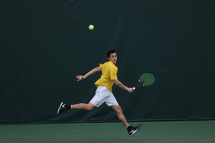 Iowa Lefteris Theodorous hits the ball back to his opponent, Utahs David Micevski during the Iowa-Utah match at the Hawkeye Indoor Tennis and Recreation Complex on Friday, March 3, 2017. The Hawkeyes defeated the Utes, 4-3. (The Daily Iowan/Margaret Kispert)