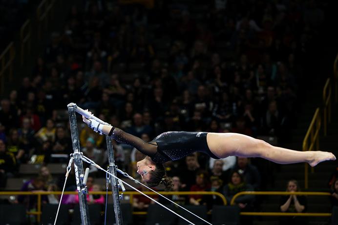 Iowa gymnast Mollie Drenth performs on the bars during the Iowa Corn Cy-Hawk meet in the Carver-Hawkeye Arena on Saturday, Feb 4, 2017. The Hawkeyes defeated the Iowa State Cyclones, 196.725-195.300 and now lead the Iowa Corn Cy-Hawk Series, 18-7. (The Daily Iowan/Osama Khalid)