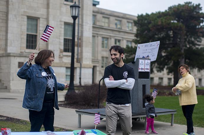 Maria Bribriesco, the Deputy State Director of LULAC, and Andrew Bribriesco at the LULAC/workers rally in front of the Old Capitol on March 30, 2017. The organization LULAC has about 16 different councils and 500 members in the state of Iowa. (The Daily Iowan/Kenny Sim)