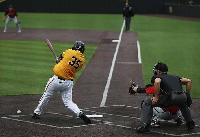 Iowa first baseman Jake Adams makes contact with the pitch during the Iowa-UNLV baseball game at Duane Banks Field on Saturday, Apr. 1, 2017. The Hawkeyes scored 3 late runs to comeback  in the second game of a double header and sweep the series with a final score of 7-6. (The Daily Iowan/ Alex Kroeze)