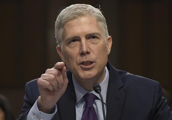 FILE - In this March 21, 2017 file photo, Supreme Court Justice nominee Neil Gorsuch testifies on Capitol Hill in Washington during his confirmation hearing before the Senate Judiciary Committee. A divided Senate Judiciary Committee backed Gorsuch, Monday, April 3, 2017. GOP likely to change Senate rules to confirm him. (AP Photo/Susan Walsh, File)