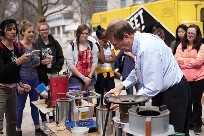Paul Anderson demonstrates different cook stoves at the Provost's Global Forum on Wednesday April 12, 2017. The forum runs through Friday. This year's theme is Women's Health & the Environment: Up in Smoke. (The Daily Iowan/Nick Rohlman)