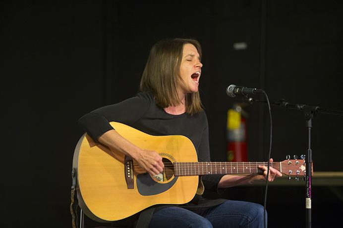 Sarah Burgess performs during the Feminist Voices Showcase event at Public Space One on Tuesday, April 11, 2017. The event featured art displays, music and poetry. (The Daily Iowan/Lily Smith)
