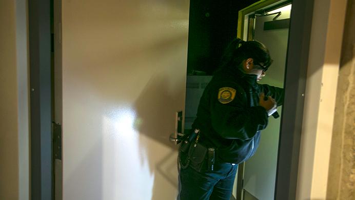 UI sophomore Daisy Torres patrols as a student security officer for the University of Iowa Police Department on Friday night, Feb. 17, 2017. Torres is a criminology law and justice student who has been working with UIPD since September in the initial hiring of students. The University plans to hire 125 new students to assist with security. (The Daily Iowan/Joseph Cress)