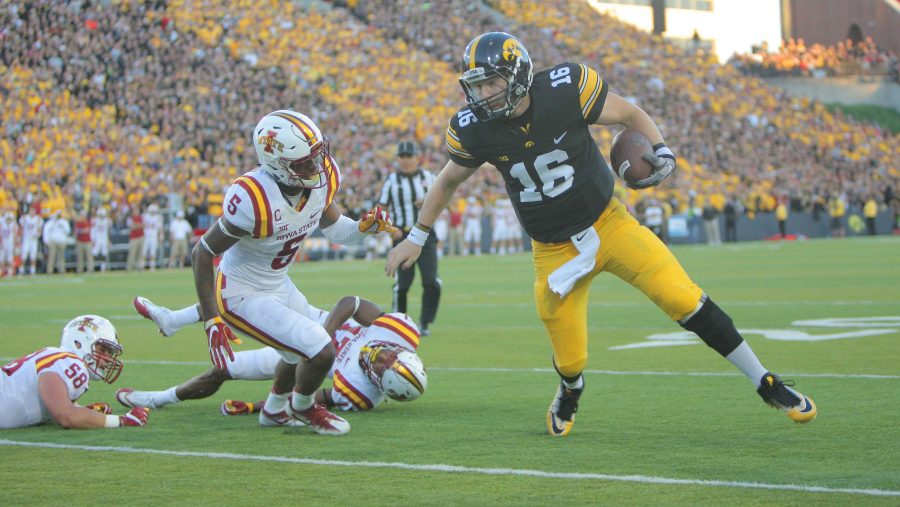 Iowa quarterback C.J. Beathard avoids several Iowa State tackles during the Iowa-Iowa State game at Kinnick on Saturday, Sept. 10, 2016. Iowa head Iowa State to one field goal to defeated them, 45-3. (The Daily Iowan/Margaret Kispert)