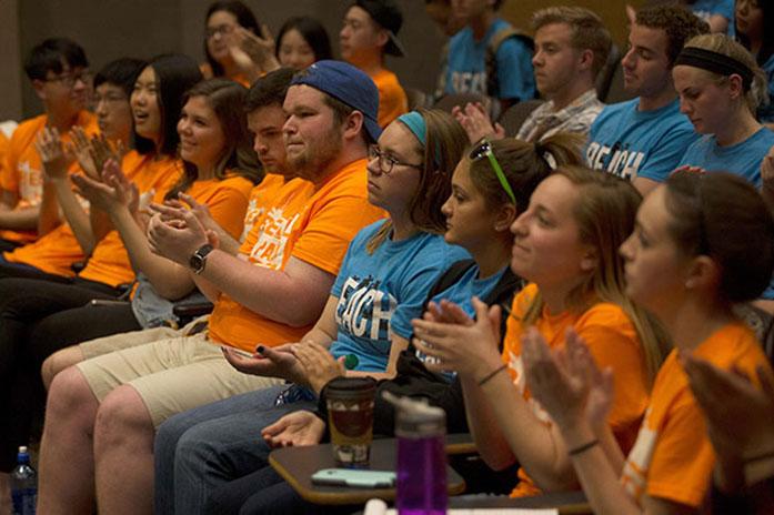 (File Photo) Members of the REAL and BEACH Parties applaud as the vice-presidential debate concludes in the Main Library Shambaugh Auditorium on Wednesday, April 1, 2015. REAL Party candidate Morgan Brittain and BEACH Party candidate Kolton Dahms discussed their platforms. (The Daily Iowan/John Theulen)