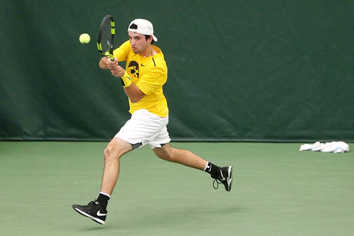 Iowa Josh Silverstein hits the ball during the Iowa-Omaha match at the Indoor Tennis and Recreation Complex on Friday, Feb. 3, 2017. The Hawkeyes xx the Durangos, xx. (The Daily Iowan/Margaret Kispert)