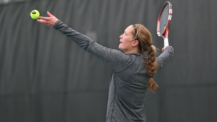 Iowa's Aimee Tarun prepares to serve the ball during the Iowa-Indiana match at the Hawkeye Tennis and Recreation Complex on Friday, March 31, 2017. The Hawkeyes were defeated by the Hoosiers, 5-2. (The Daily Iowan/Margaret Kispert)