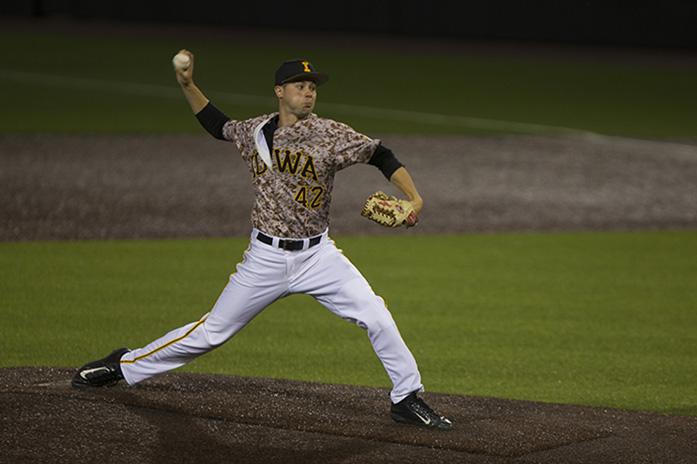 Drake+Robison+delivers+a+pitch+in+the+8th+inning+of+the+Hawkeyes+4-3+victory+over+Milwaukee+on+April+25th%2C+2017.+Robison+pitched+two+shutout+innings+to+end+the+game.+%28The+Daily+Iowan%2FNick+Rohlman%29