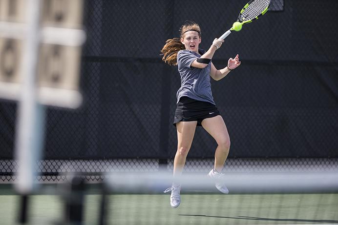 Iowas+Zoe+Douglas+returns+a+serve+during+the+match+against+Penn+State+at+Hawkeye+Tennis+and+Recreation+Complex+on+Sunday%2C+April+9.+The+Hawkeyes+went+on+to+defeat+the+Nittany+Lions+6-1.+%28The+Daily+Iowan%2FBen+Smith%29