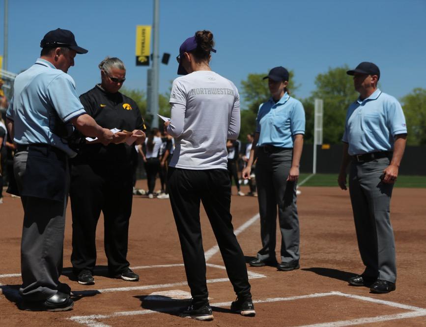 Iowa head coach Marla Looper meets at home plate before the Iowa/Northwestern game at Pearl Field on Sunday, May 7, 2017. The softball team will be holding open tryouts on August 30. (Alex Kroeze/The Daily Iowan, file)