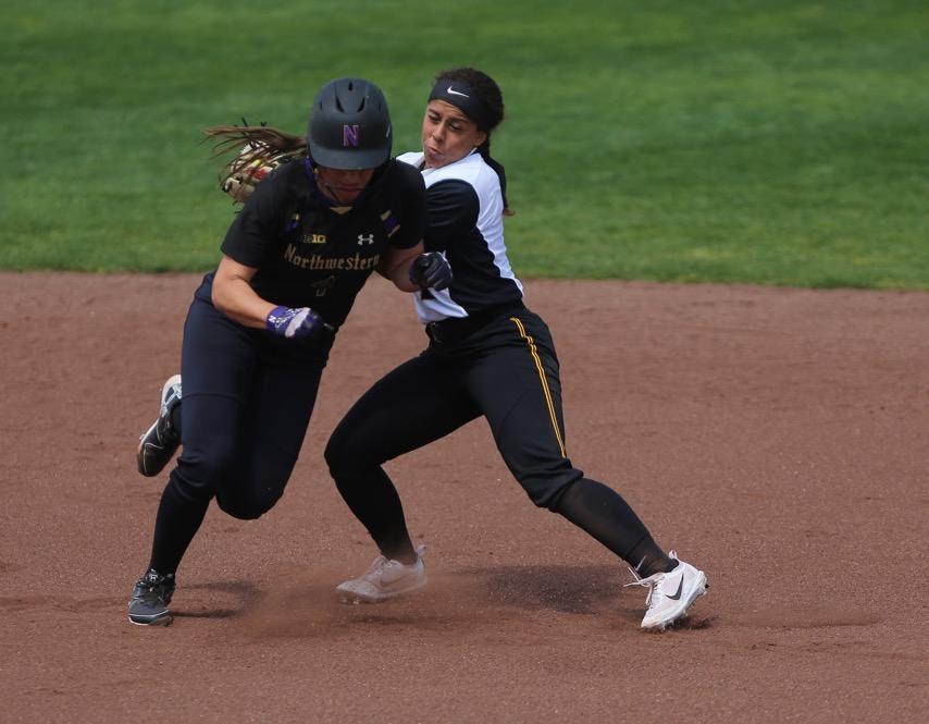 Iowa infielder Lea Thompson tags out the runner during the game between Iowa/Northwestern at Pearl Field on Sunday, May 7, 2017. On Iowas senior day they fell to the Wildcats 5-2. (The Daily Iowan/ Alex Kroeze)