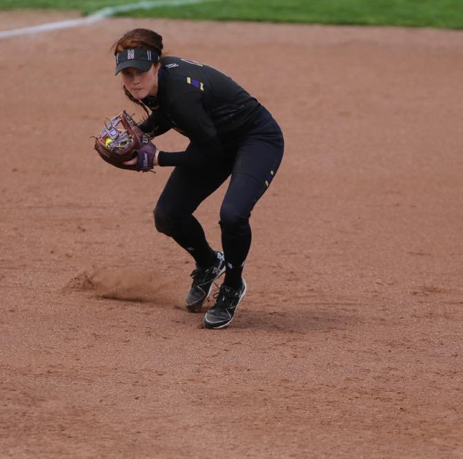 Northwestern infielder Morgan Nelson winds up to throw towards first base during the game between Iowa/Northwestern at Pearl Field on Sunday, May 7, 2017. On Iowas senior day they fell to the Wildcats 5-2. (The Daily Iowan/ Alex Kroeze)