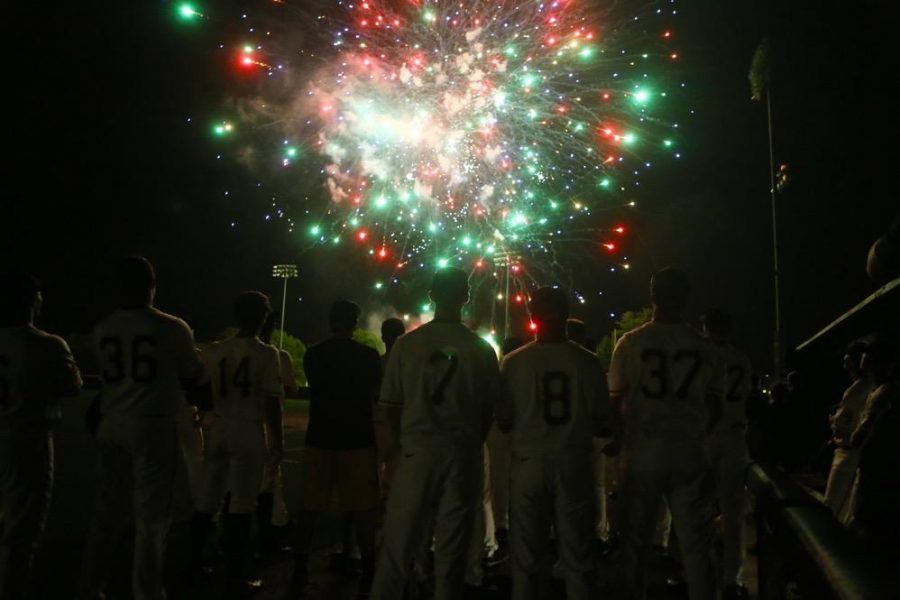 The Iowa team watch as fireworks end their season at home after the game between Omaha-Iowa at Duane Banks Field on Tuesday, May 16, 2017. The Hawkeyes pull off another comeback win with three runs in the 8th inning and two runs in the 9th inning for the 9-8 victory. (The Daily Iowan/ Alex Kroeze)