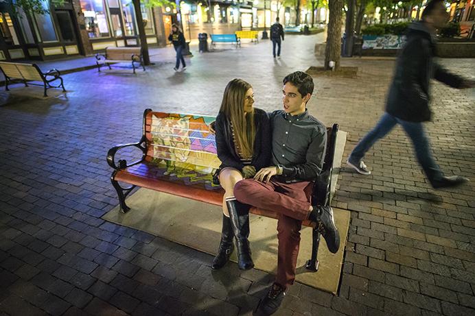 University+of+Iowa+Students%2C+Autumn+Hagemaster+and+Louis+DelVecchio%2C+take+a+moment+to+pose+for+a+photo+on+a+recently+painted+bench+in+Iowa+Citys+Ped+Mall.+The+benches+were+painted+by+local+artists+to+raise+awareness+of+the+importance+of+funding+the+arts.+%28The+Daily+Iowan%2FJames+Year%29
