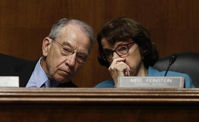 Senate Judiciary Committee Chairman Sen. Charles Grassley, R-Iowa, and the committees ranking member Sen. Dianne Feinstein, D-Calif., speak on Capitol Hill in Washington, Wednesday, May 3, 2017, as FBI Director James Comey testified before the committees hearing: Oversight of the Federal Bureau of Investigation. (AP Photo/Carolyn Kaster)