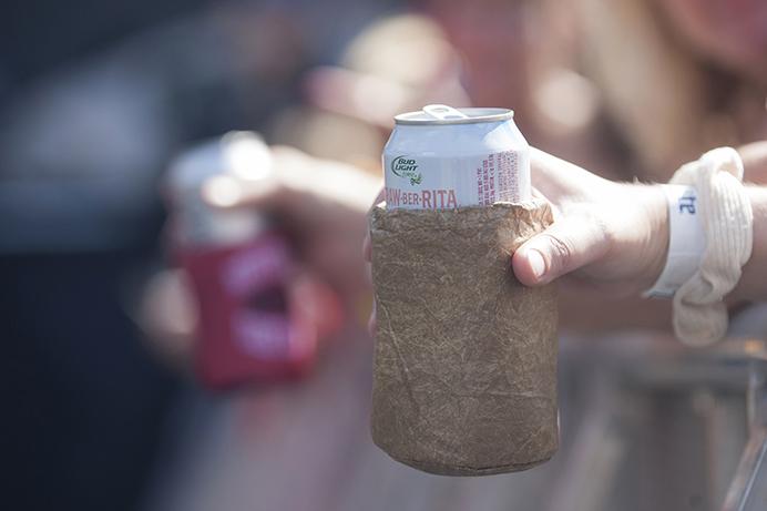 Crowd members hold beers in koozies  during the Back Porch Revival at Kinnick on Saturday, Aug. 27, 2016. Back Porch was the first concert in the 87-year old stadium. (The Daily Iowan/Margaret Kispert)