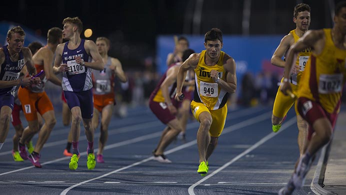 Iowas Carter Lilly takes a handoff during the 4x800 at Drake Stadium during the Drake Relays on Friday, April 28, 2017. Iowa won with a time of 7:24.77. (The Daily Iowan/Joseph Cress)